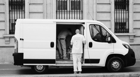 a-man-standing-next-to-a-van.jpg a man standing next to a van